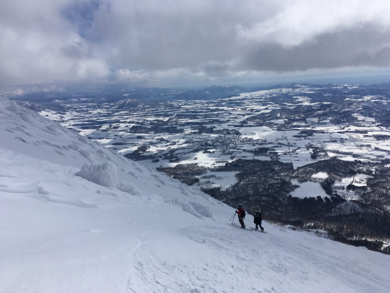 Skiing down Mt Yotei